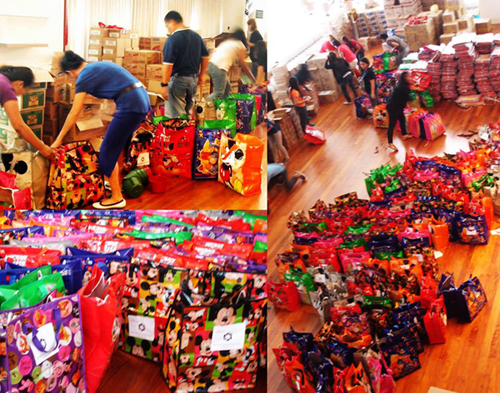 Staff and volunteers of the AY Foundation pack relief goods to be distributed to typhoon victims